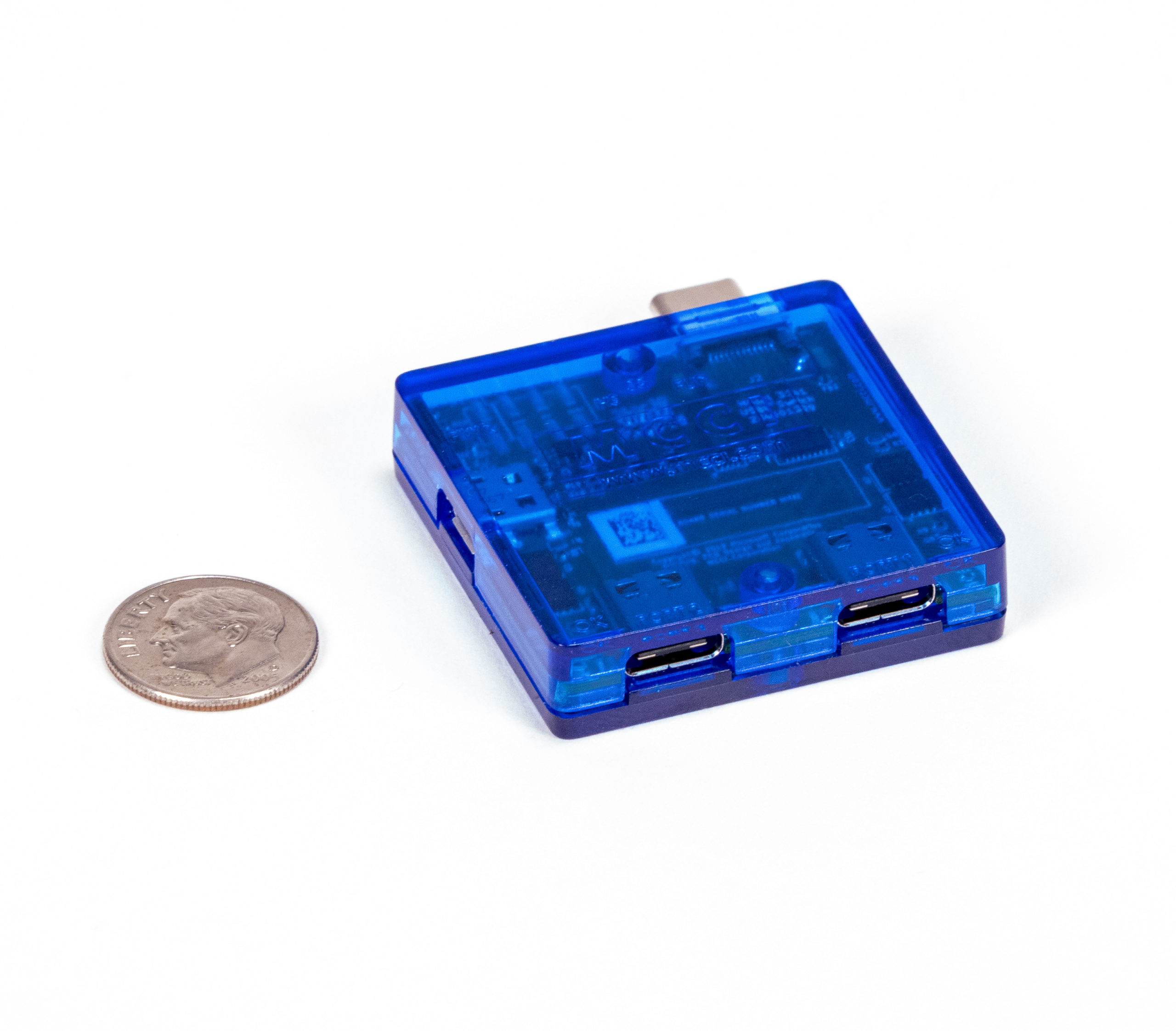 USB4 Switch in enclosure, with dime for scale